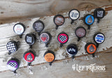 Group of various racing themed badge reel clips.
