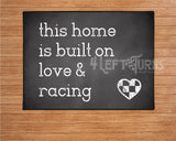 This home is built on love and racing welcome mat.