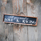 All you need is love and racing shelf sitter sign.