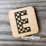 Checkered letter E wooden magnet.