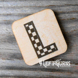 Checkered letter L wooden magnet.