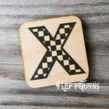 Checkered letter X wooden magnet.