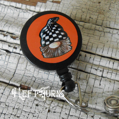Gnome with orange background badge reel clip.