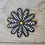 Checkered daisy sticker.