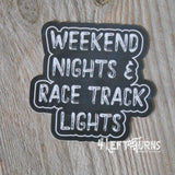 Weekend nights and race track lights racing sticker.