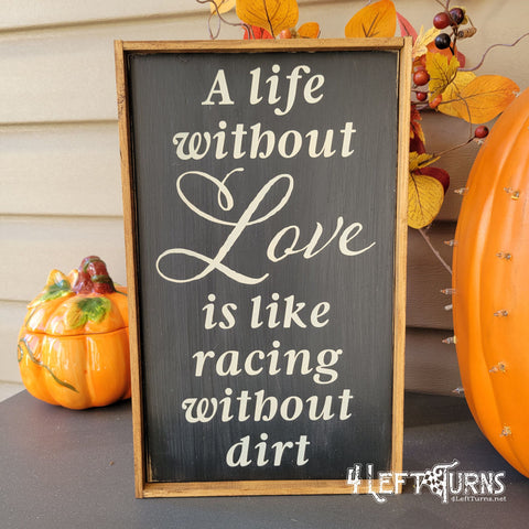 Wood sign featuring the words "A life without love is like racing without dirt."