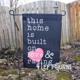 Racing garden flag, black. This home is built on love & racing.