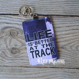 Life is better at the track credit card/identification holder key rings.