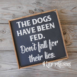 The Dogs and Their Lies Wood Sign