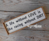 Wooden shelf sign that says A life without love is like racing without dirt.