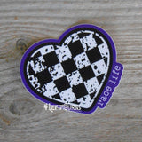 Checkered heart with purple background and the words race life sticker.