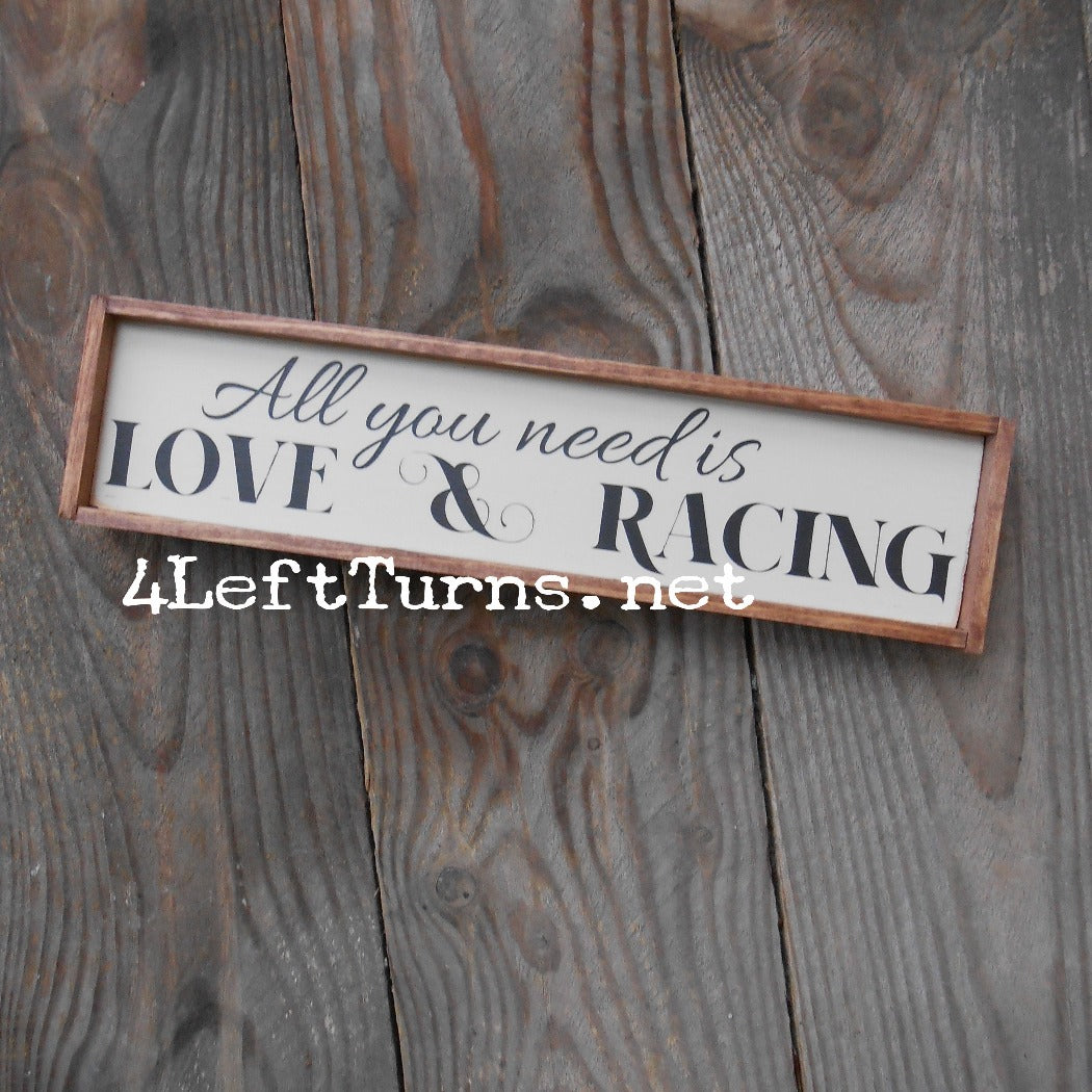 All you need is love and racing shelf sitter sign.