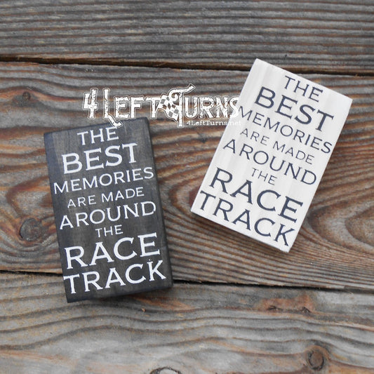 Tiny wood signs that say The Best Memories are made around the race track.