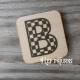 Checkered letter B wooden magnet.