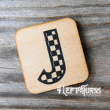 Checkered letter J wooden magnet.