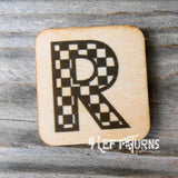 Checkered letter R wooden magnet.