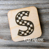 Checkered letter S wooden magnet.